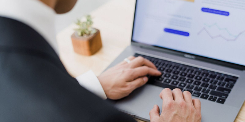 Professional reviewing information on a laptop